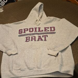"Spoiled Brat"Label on  Gray Fabric